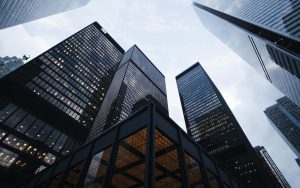 view of big skyscrapers from the ground - quantity surveying vs building surveying